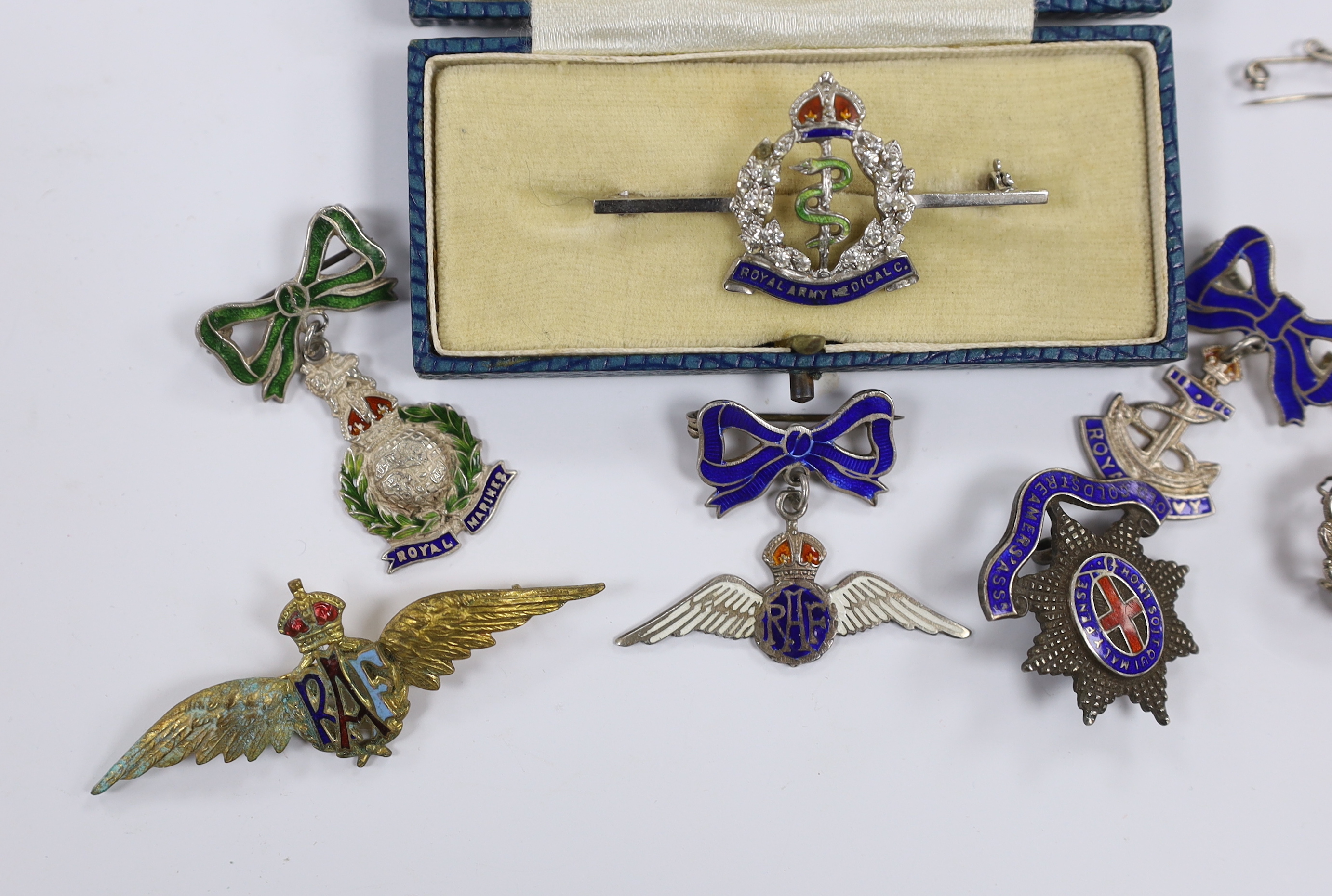Seven white metal etc. enamelled sweetheart and related brooches, examples including; RAF, Royal Navy, RAMC, Royal Marines, etc.